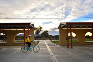 Bicyclist at Raton Depot Multi-Modal Center at Sunrise, by Tim Keller