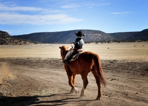 Kade Brown as "John Wayne" horseback at Brown Ranch branding 2012