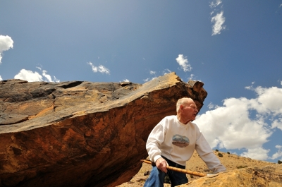 Willard Louden shows petroglyphs to Dry Cimarron tour