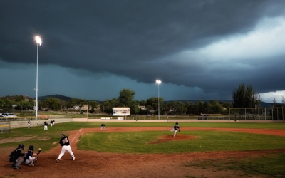 Raton Osos under a storm at Gabriele Field
