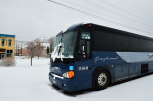 Greyhound bus waits in snow at Raton, New Mexico