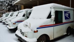 U.S. Mail Trucks wait in snow
