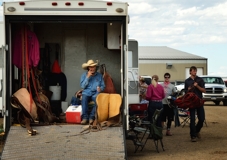 Oklahoman Gary Cates takes a call, 105th Trindad Round-Up Rodeo