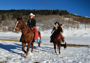 Anne Sporleder & Micheli Walton horseback at Sugarite Canyon Ranch, Dec 2015