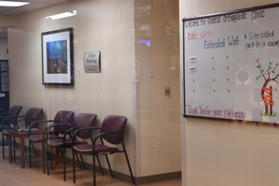 UNM Hospital Orthopaedic Clinic with Tim Keller photograph in waiting room, 2016