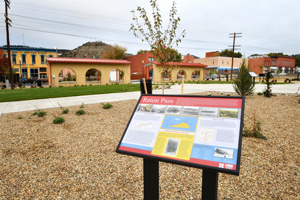 Raton Pass sign at Raton Depot on cloudy morning