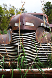 Rusted Chevrolet coupe in Yankee Canyon pasture