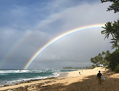 Rainbow over Sunset Beach from Rocky Point on Oahu's North Shore