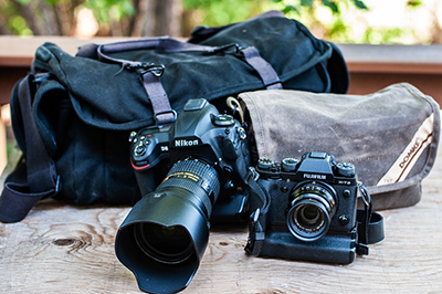 Fujifilm X-T2 beside Nikon D5 and Domke bags