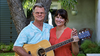 Tim Keller & daughter Darcy Keller with her famous Takamine D28 guitar, Austin, June 2018