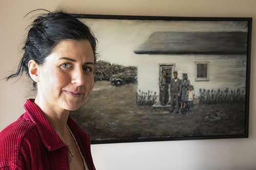 Colorado artist Lindsay Hand with her "The Valley, 1945" at Raton, NM
