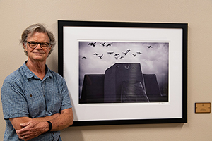 Photographer Tim Keller with his new installation "Alight" at Taos Senior Center, July 2020. Photographer Tim Keller with his new installation "Alight" at Taos Senior Center, July 2020.