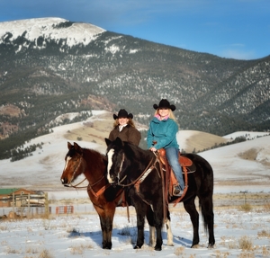 Janna Mills & Ashlee Rose Mills horseback in Eagle Nest winter