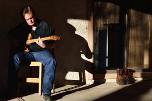 Dino Cornay plays his Telecaster on his back porch in Folsom, NM